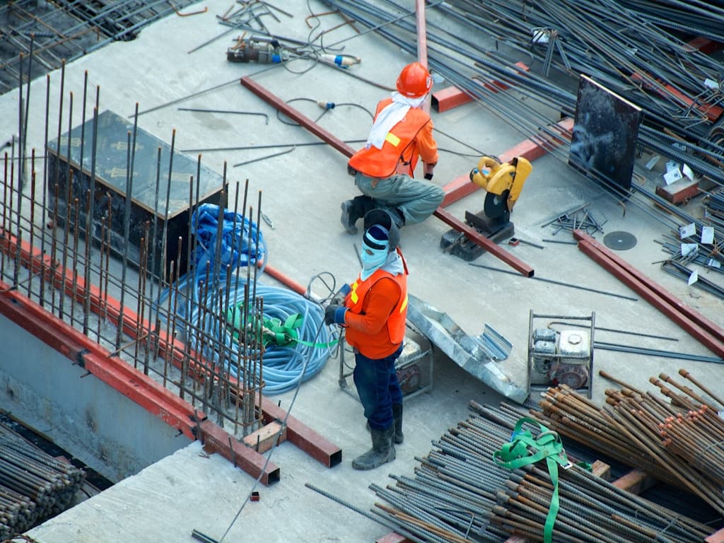 Foreman on a job site using a phone
